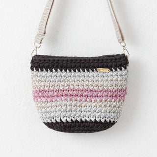Crocheted bag with gradient pattern on a white background