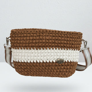 A handmade crochet crossbody bag in coffee brown and ivory colors, made from cotton.