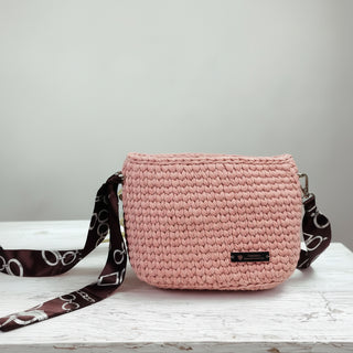 Handmade crochet crossbody bag in a marshmallow white color, displayed on a white surface.