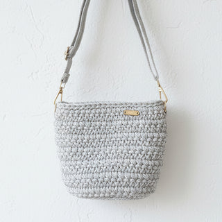 Crochet handbag with a textured background
