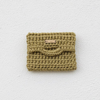 Textured yellow pouch on a white surface