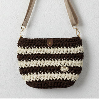 Brown and beige striped handbag on a light gray background